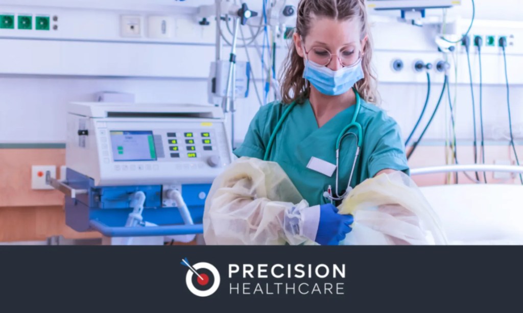 Nurse in scrubs and a mask caring for a patient, Precision Healthcare